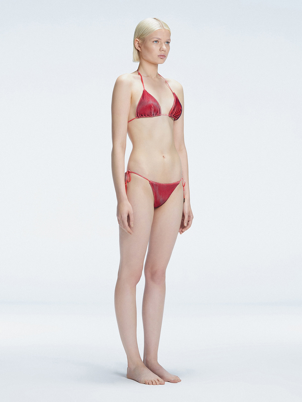 Hermione Red Side Tie 3D Bikini Bottom | Moeva | Bikini Bottom | Each week unveils new pieces—luxury swimwear, fluid resort silhouettes, and elevated summer-to-evening essentials designed to carry you from coastal escapes to city nights.
