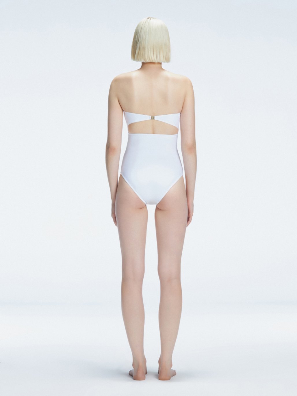 Ursula White Bandeau Swimsuit | Moeva | Swimsuit | Each week unveils new pieces—luxury swimwear, fluid resort silhouettes, and elevated summer-to-evening essentials designed to carry you from coastal escapes to city nights.
